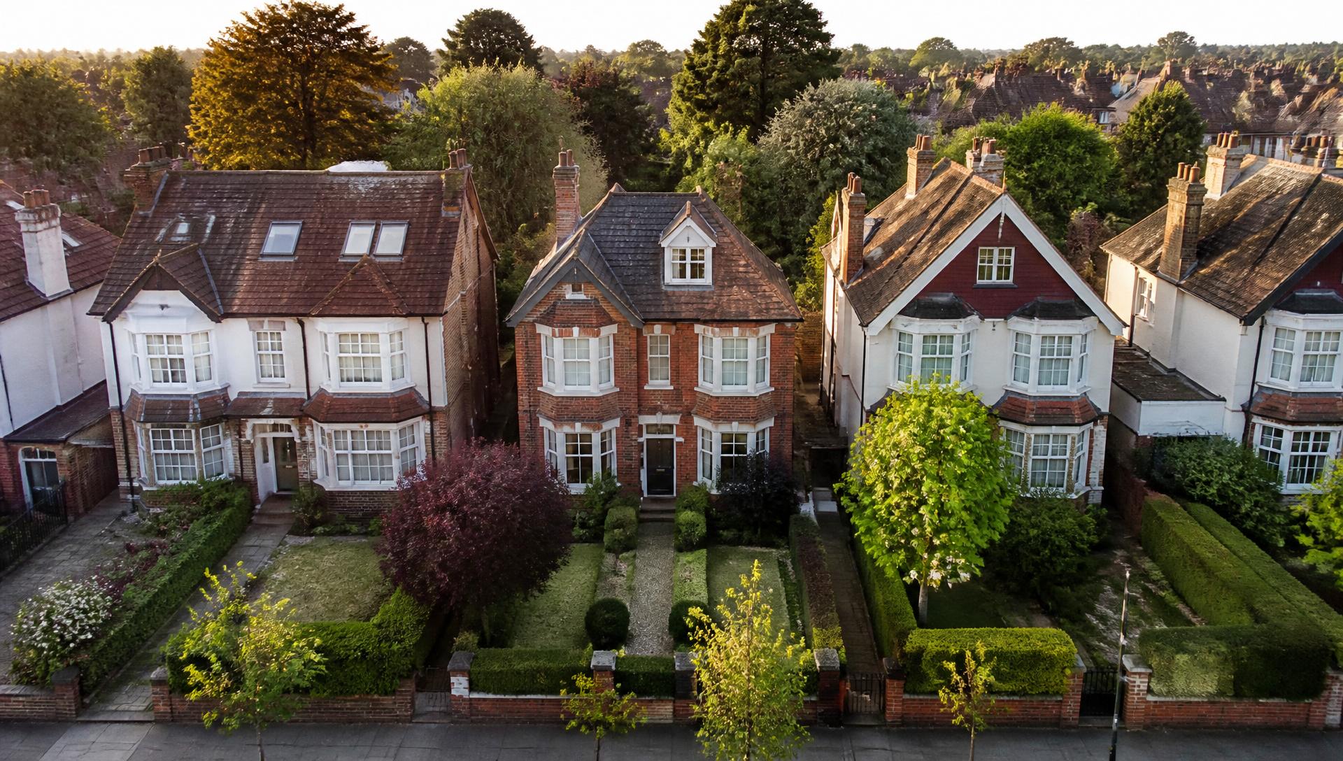 Elegant detached and semi-detached British homes with manicured gardens